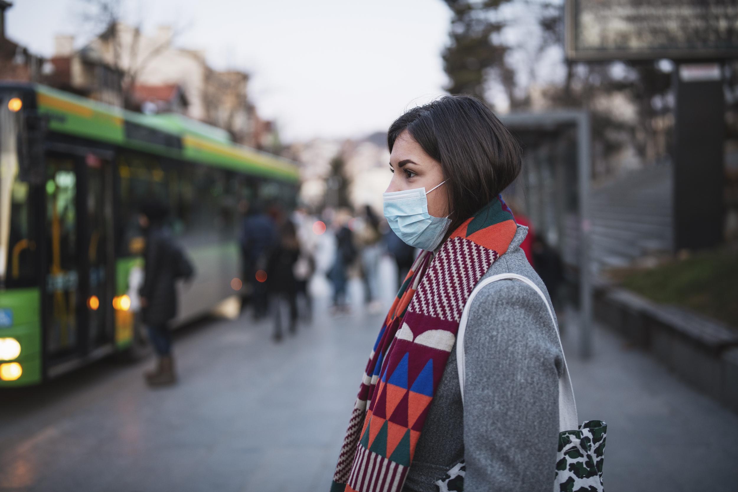 woman in town wearing protective face mask